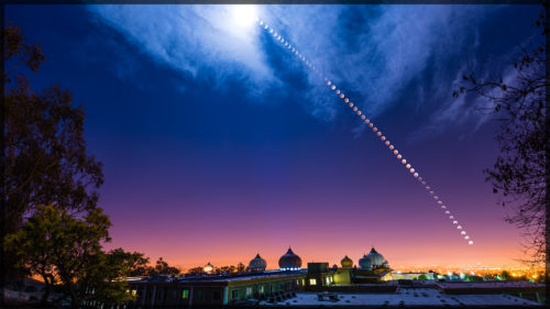 Lunar Eclipse Over Temple